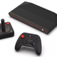 The Atari VCS, its old-school joystick, and a more modern controller.